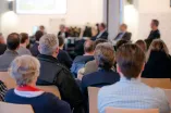 People in a conference room from behind