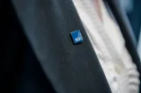 A jacket with a RUB pin