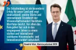 Ministerpräsident Hendrik Wüst vor Flaggen der EU, der BRD und des Lands NRW.