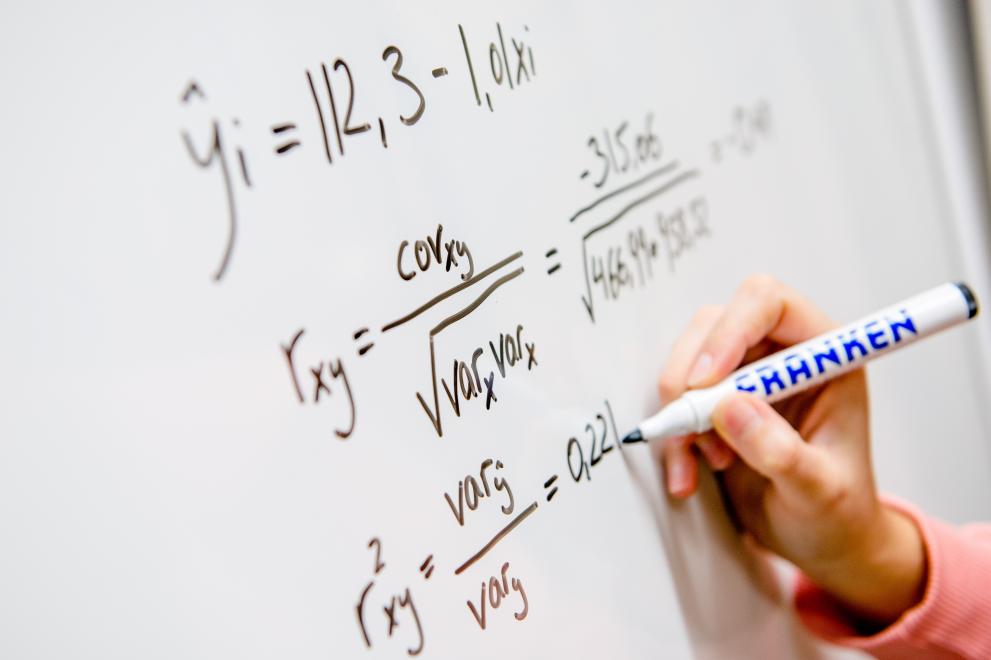 Mathematical formulas on a whiteboard