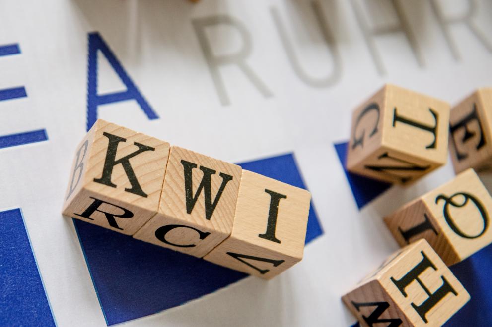 Letter Cubes spelling the abbreviation KWI
